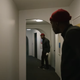 Candyman star Yahya Abdul-Mateen II stares at his reflection in a scene from the upcoming horror sequel.